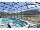 Enjoy the crystal-clear pool and inviting hot tub within a screened enclosure, perfect for relaxation and recreation at 4157 Lana Ave, Davenport, FL 33897