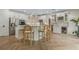 Modern kitchen with island and stool seating, stainless steel appliances, and custom cabinets at 421 E Gore St, Orlando, FL 32806