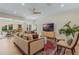 Spacious living room with modern ceiling fan open to formal dining room, offering comfortable living space at 421 E Gore St, Orlando, FL 32806