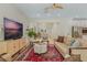 Bright living room with stylish furniture, including a large TV and elegant decor at 421 E Gore St, Orlando, FL 32806
