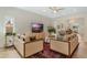 Bright and airy living room featuring modern furnishings and seamless transition to other living areas at 421 E Gore St, Orlando, FL 32806
