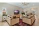 Bright and airy living room featuring modern furnishings and seamless transition to other living areas at 421 E Gore St, Orlando, FL 32806