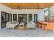 Outdoor living area features ceiling fans and a dining set, perfect for entertaining at 421 E Gore St, Orlando, FL 32806
