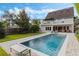 Stunning backyard with a large swimming pool and well-manicured landscaping at 421 E Gore St, Orlando, FL 32806