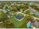 Aerial view of a single-Gathering home with a lush green yard, privacy fence and mature landscaping at 4944 Tinkham Ave, Orlando, FL 32812