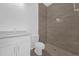 Bathroom featuring a walk-in shower, toilet and single sink vanity at 4944 Tinkham Ave, Orlando, FL 32812