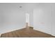 Empty bedroom featuring wood flooring and double door closet at 4944 Tinkham Ave, Orlando, FL 32812