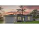 Charming single-story home featuring a well-maintained lawn, attached garage, and neutral color palette at 4944 Tinkham Ave, Orlando, FL 32812