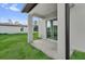 The back porch features a new sliding glass door and a large green backyard at 495 Dean Creek Ln, Orlando, FL 32825