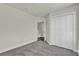 Bedroom with gray carpet, white trim, and a closet at 495 Dean Creek Ln, Orlando, FL 32825