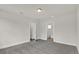 This is a bedroom featuring neutral walls, gray carpet and two doorways at 495 Dean Creek Ln, Orlando, FL 32825