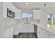 This kitchen is bright and spacious with stainless appliances and white quartz countertops at 495 Dean Creek Ln, Orlando, FL 32825