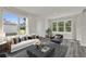 Bright living room with large windows, stylish furniture, and elegant decor at 495 Dean Creek Ln, Orlando, FL 32825