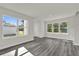 Bright and airy living room with large windows and sleek, modern flooring at 495 Dean Creek Ln, Orlando, FL 32825