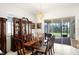 Dining area with backyard access and large china cabinet, perfect for entertaining guests at 5159 Twin Lakes Blvd, St Cloud, FL 34772