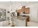 Modern kitchen featuring stainless steel appliances, a granite island with barstool seating at 5159 Twin Lakes Blvd, St Cloud, FL 34772