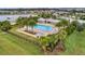 Aerial view of a sparkling pool and lounging area nestled within a lush landscape at 5159 Twin Lakes Blvd, St Cloud, FL 34772