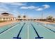 Community swimming pool with lane markers and palm trees in the background at 5159 Twin Lakes Blvd, St Cloud, FL 34772