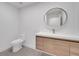 Bright bathroom with a modern sink and light-up round mirror at 6593 Queens Borough Ave # 202, Orlando, FL 32835