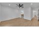 Spacious bedroom with wood floors and ceiling fan at 6593 Queens Borough Ave # 202, Orlando, FL 32835