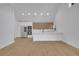 Bright, open-concept kitchen with stainless steel appliances, custom cabinetry and eat-in counter space at 6593 Queens Borough Ave # 202, Orlando, FL 32835
