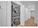 Convenient in-unit laundry featuring a stacked washer and dryer at 6593 Queens Borough Ave # 202, Orlando, FL 32835