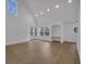 Spacious living room with vaulted ceilings, natural light, and a built-in desk area by the windows at 6593 Queens Borough Ave # 202, Orlando, FL 32835