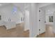 Open living space with modern finishes, including a kitchen island and light hardwood floors at 6593 Queens Borough Ave # 202, Orlando, FL 32835