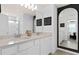 The bathroom features double sinks with a quartz countertop and decorative mirrors at 6736 Reverie Park Ave, Orlando, FL 32829