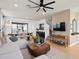 Inviting living room with an open floor plan, hardwood floors, and modern decor at 6736 Reverie Park Ave, Orlando, FL 32829