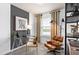 Home office with modern acrylic glass desk, ergonomic chair and gold accents at 6736 Reverie Park Ave, Orlando, FL 32829