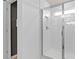 Bright bathroom shower with glass doors and subway tile surround at 6736 Reverie Park Ave, Orlando, FL 32829