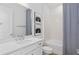 Bathroom with white tile, white vanity, a mirror, and a shower with a tub at 6744 Willow View Ave, Orlando, FL 32829