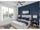 Comfortable bedroom with a large window for natural light, complemented by modern decor at 6744 Willow View Ave, Orlando, FL 32829