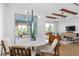 This gorgeous dining room has great natural light and access to the backyard at 6744 Willow View Ave, Orlando, FL 32829