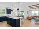 This spacious kitchen has a large island, pendant lighting, and stainless steel appliances at 6744 Willow View Ave, Orlando, FL 32829