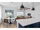 The open-concept living space has sleek beams and access to the backyard at 6744 Willow View Ave, Orlando, FL 32829