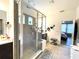 Bathroom with a large glass enclosed shower, double vanity and tile flooring at 7035 Oxbow Rd, Minneola, FL 34715