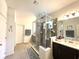 Bathroom featuring a glass enclosed shower, double vanity and modern fixtures at 7035 Oxbow Rd, Minneola, FL 34715