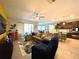 Spacious living room features a large sectional sofa and open floor plan connecting to the kitchen at 7035 Oxbow Rd, Minneola, FL 34715