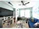 Inviting home office with light blue walls, a ceiling fan, and a comfortable work space by the bright window at 7035 Oxbow Rd, Minneola, FL 34715