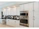 Kitchen featuring white cabinets and stainless steel appliances at 727 Cricklewood Ter, Heathrow, FL 32746