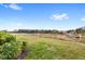 Expansive backyard with a pond view, offering tranquility and a connection to nature at 7845 Oak Reflection Loop, Davenport, FL 33837