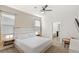 Comfortable bedroom featuring a plush bed, modern lighting, and a view of the backyard at 7845 Oak Reflection Loop, Davenport, FL 33837