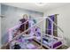 Bright bedroom with twin beds and Frozen themed wallpaper at 7845 Oak Reflection Loop, Davenport, FL 33837