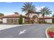 Beautiful clubhouse with Mediterranean architecture, lush landscaping, and a grand entrance at 7845 Oak Reflection Loop, Davenport, FL 33837