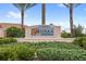 Welcoming Solterra Springs community sign with lush landscaping and palm tree accents at 7845 Oak Reflection Loop, Davenport, FL 33837