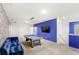 Open game room with a pool table, blue accent wall, and cartoon-themed wallpaper at 7845 Oak Reflection Loop, Davenport, FL 33837