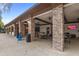 Inviting outdoor seating area featuring ceiling fans, multiple TVs, and spacious seating arrangement at 7845 Oak Reflection Loop, Davenport, FL 33837