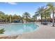 Spacious pool area with ample lounge seating, a water slide, and a charming cabana for relaxation at 7845 Oak Reflection Loop, Davenport, FL 33837